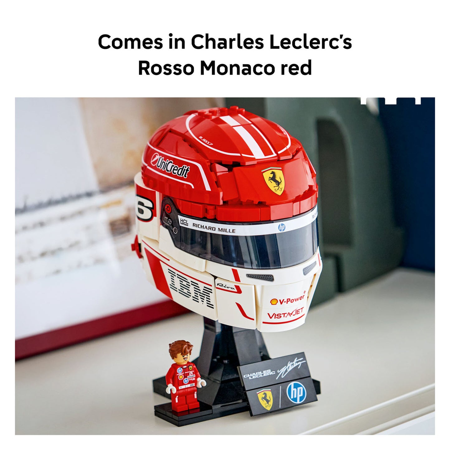 Model racing helmet and figure with branding on a stand