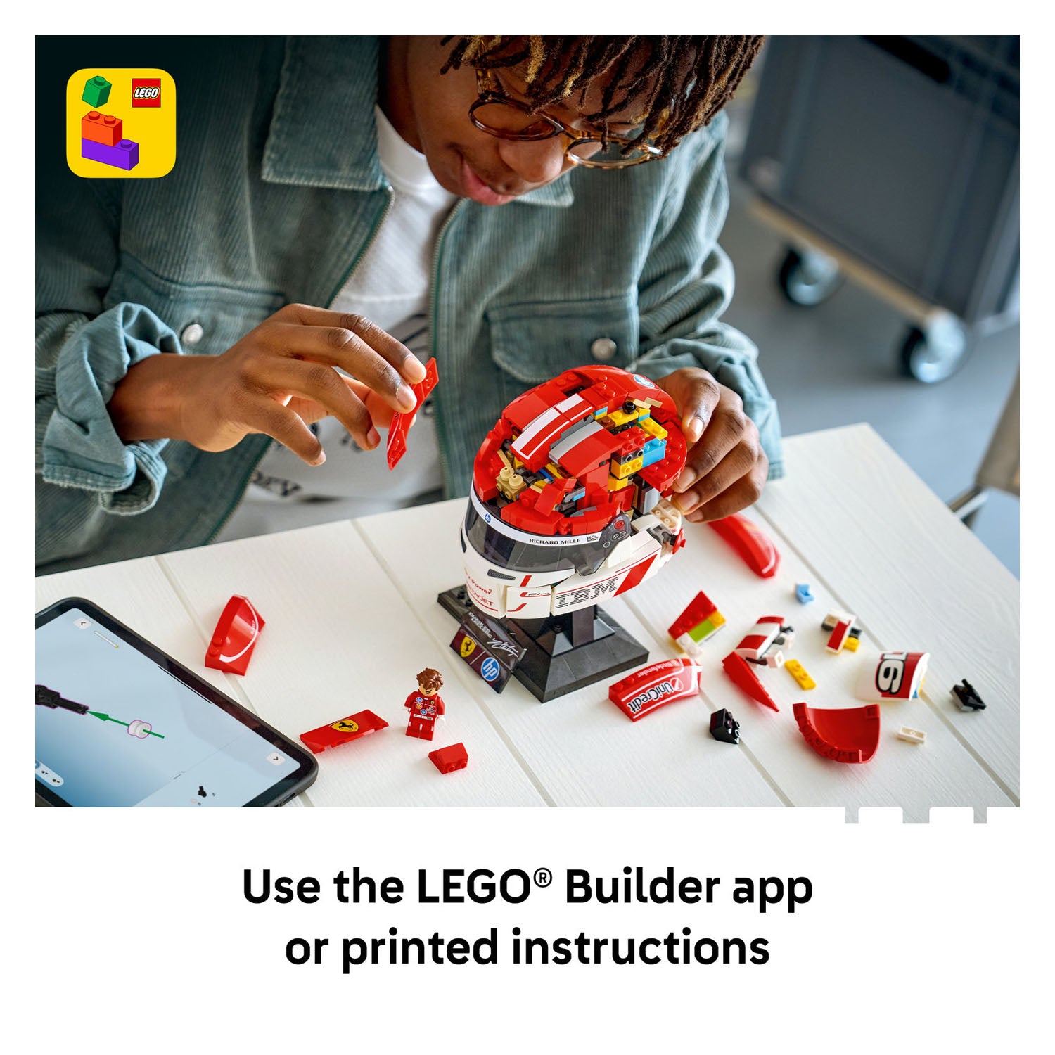 Child building a LEGO set with a smartphone displaying the LEGO Builder app.